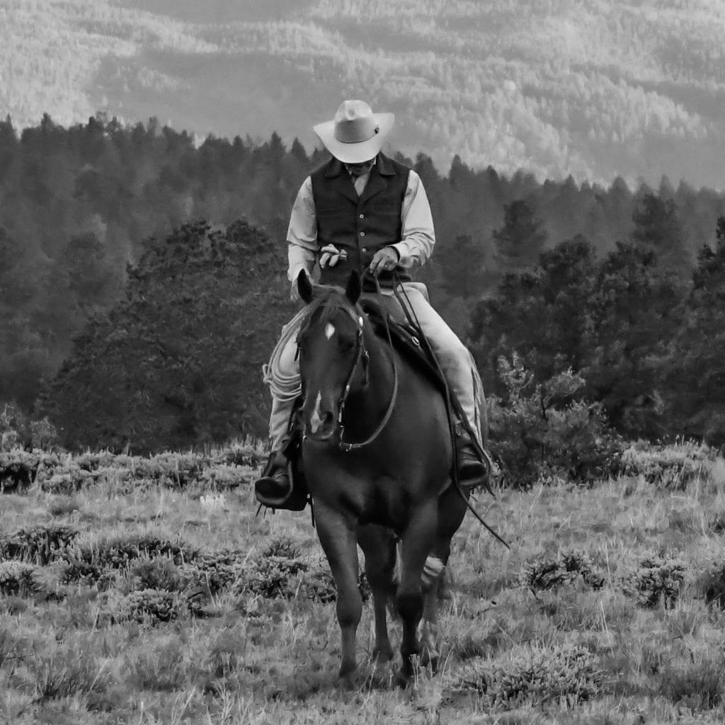 Eddie and Julie's husband Rich, with his head bowed, black and white photo.