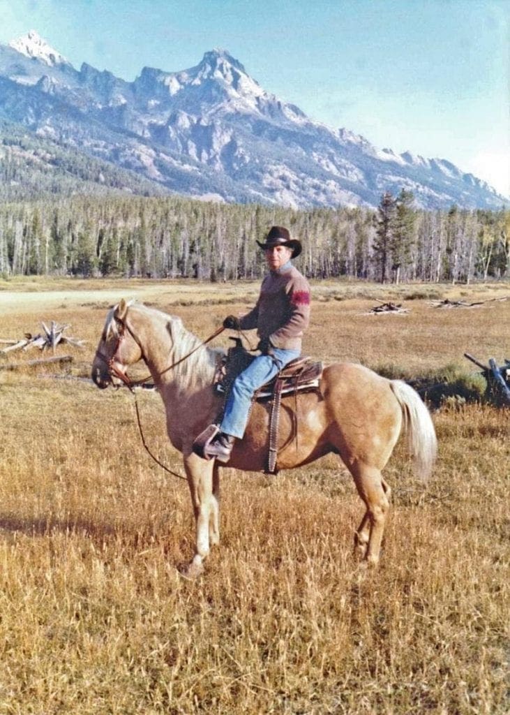 Julie's dad on his palomino trail horse, Scout.