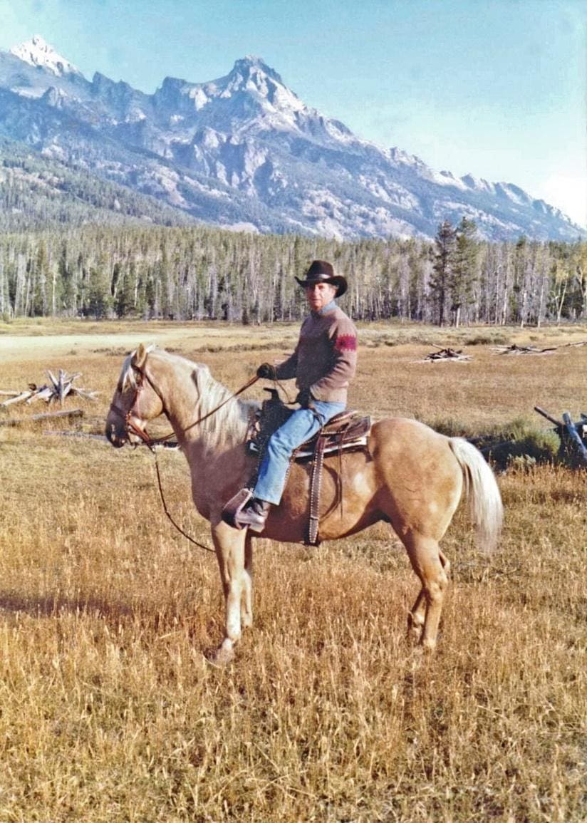 Julie's dad on his palomino trail horse, Scout.