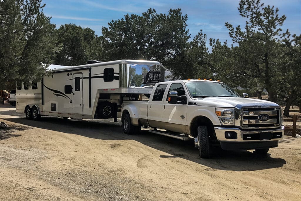 Truck pulling a horse trailer.